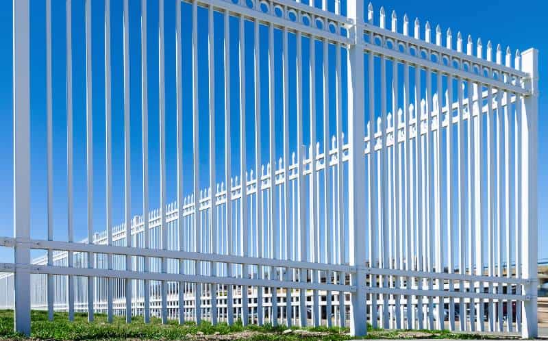 white picket fence blue sky