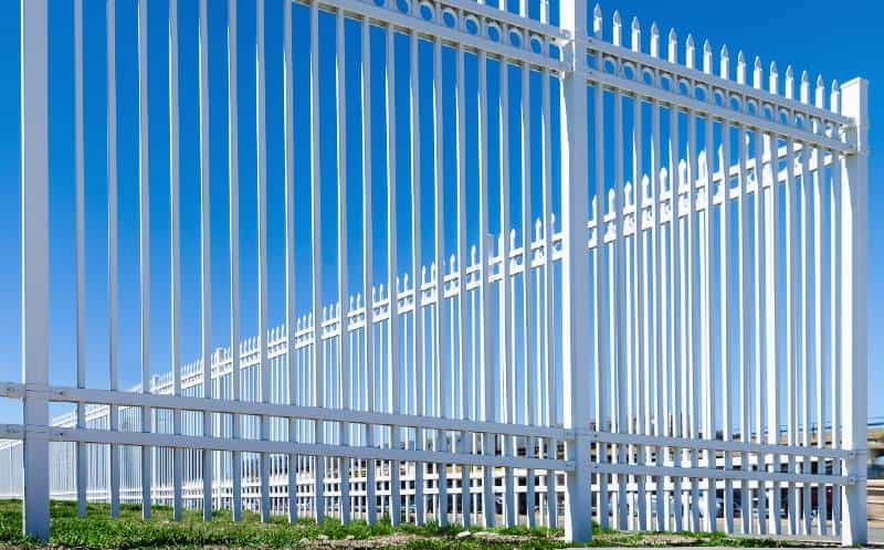 white picket fence blue sky