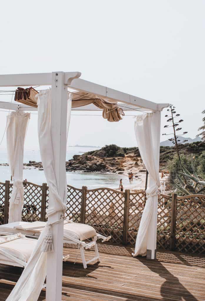 gazebo pergola canopy on deck with wood rail water sky white