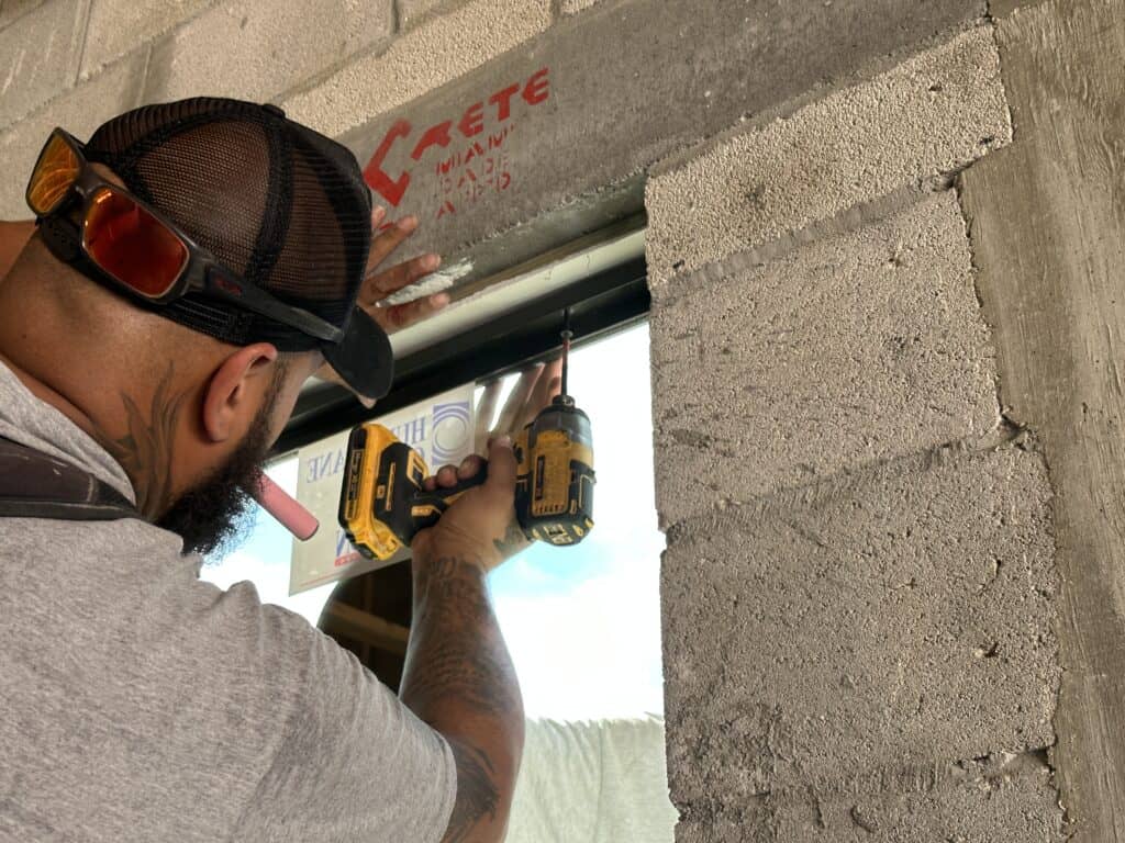 Javier installing a window