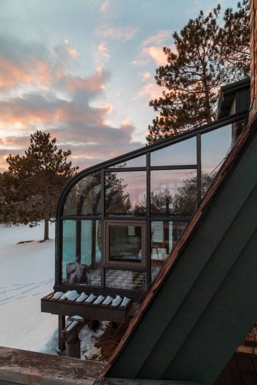 glass sunroom near snow blue sky glass window